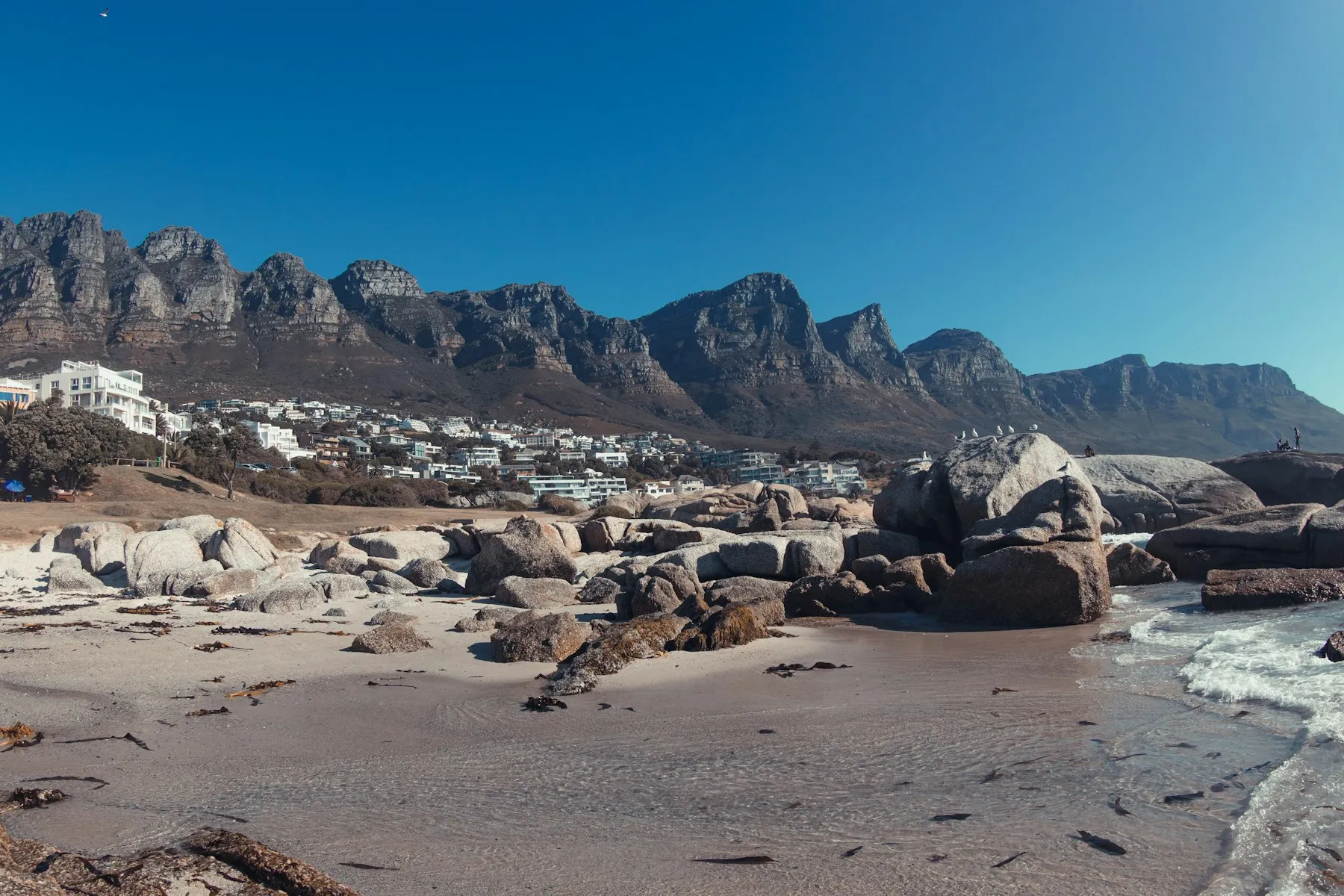 Clifton beach boulders with the Twelve Apostles behind