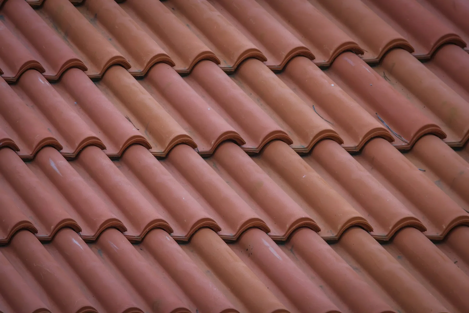 Close view of overlapping clay roof tiles